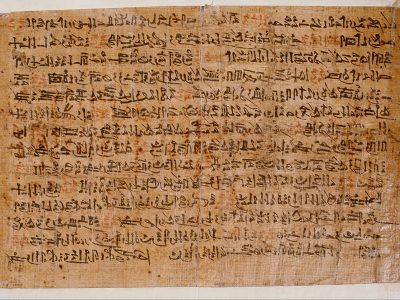 A photo of the Ipuwer Papyrus (Papyrus Leiden I 344 recto), an ancient Egyptian manuscript describing a widespread catastrophe, with visible hieratic script.